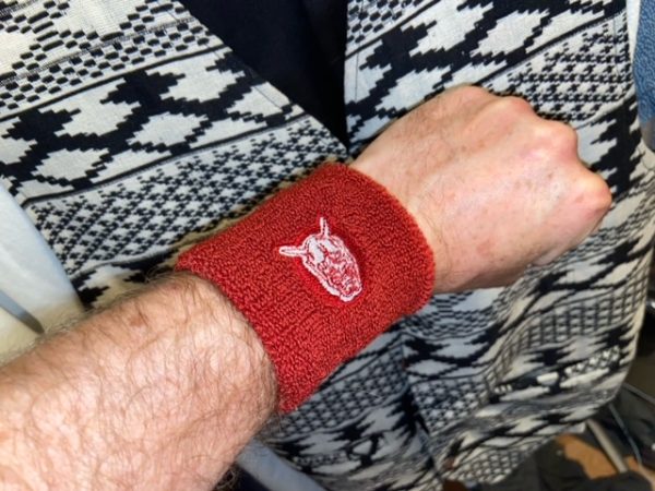 One pair of red Tokyo Five wristband sweatbands. One size fits all.