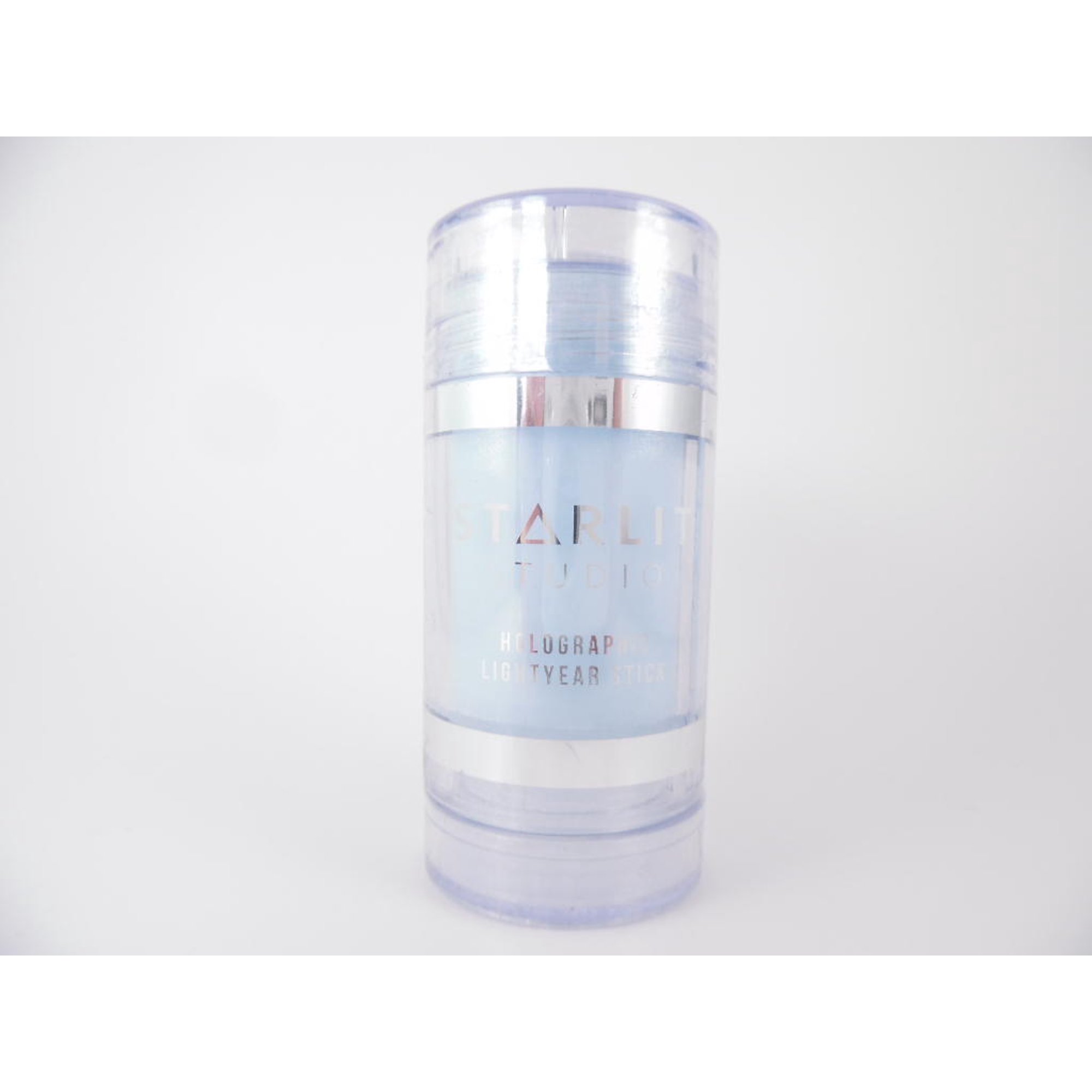 Holographic/iridescent cosmetic base / highlighter, light blue, box of three sticks.